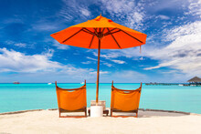 Sun Bed And Parasol At Tropical Beach