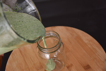 Sticker - Pouring of fresh smoothie to the glass