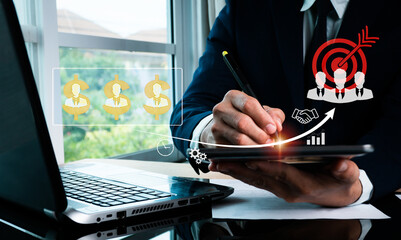 businessman while a programmer examines and produces data on a future virtual interface screen on a 