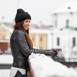 Portrait of beautiful smiling woman in winter outdoor