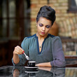 Beautiful woman with a cup of coffee. Indoor cafe