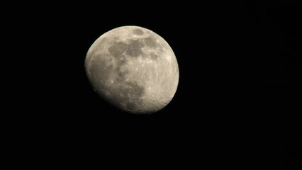Wall Mural - bright full moon against black dark sky. static shot