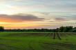Green Farmland Meadow in Countryside at Dusk in Sunset