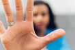 © Dani D.G - Close-up of a woman's palm, makes the hand stop the denial gesture, expresses prohibition, rejection, fights for equal rights against domestic violence, abuse, discrimination, harassment
