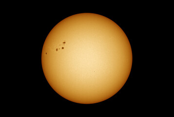 Wall Mural - sun in dark space with solar spots on the 20th april 2022