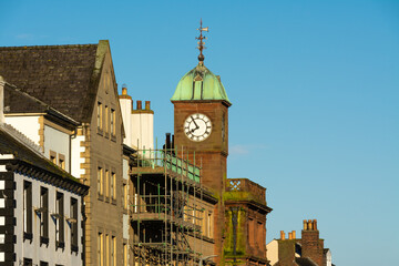 Wall Mural - Old clock tower in English city.