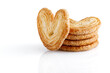 Palmier cookies or puff pastry ears isolated on white background. Cookies in the shape of a heart. Full depth of field. Close-up.