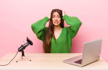 Wall Mural - hispanic pretty woman feeling stressed, anxious or scared, with hands on head. influencer concept