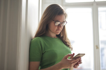 portrait of young girl using a smartphone