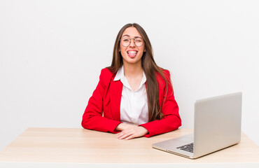 Poster - hispanic pretty woman with cheerful and rebellious attitude, joking and sticking tongue out.  business and desk concept