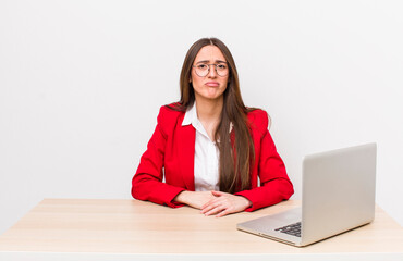 Poster - hispanic pretty woman feeling sad and whiney with an unhappy look and crying.  business and desk concept