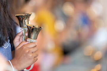 Person playing handbells with negative space