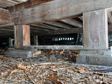 Crawl Space With Concrete Supports Under Florida House.