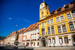 © AnnaRudnitskaya - Cheb, Western Bohemia, Czech Republic, 14 August 2021: King George of Podebrady Square, Eger at sunny day, medieval colorful gothic historic renaissance and baroque buildings, town hall with tower