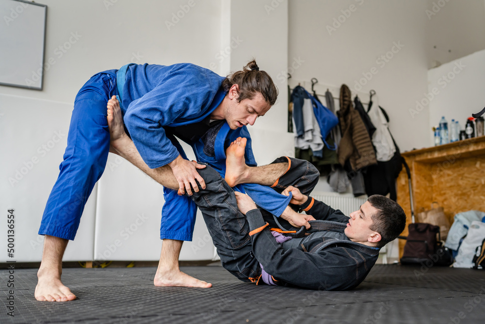 Fotografie Two brazilian jiu jitsu BJJ athletes training at the academy ...