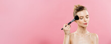 Beauty Concept - Closeup Beautiful Caucasian Woman Applying Makeup With Cosmetic Powder Brush. Perfect Skin. Isolated On Pink Background And Copy Space.