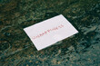 © slrmclaren - paper with text unhappiness thrown in a puddle