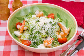 Wall Mural - salad caesar with shrimps on green plate