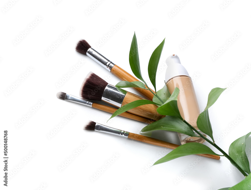 Foundation and makeup brushes isolated on white