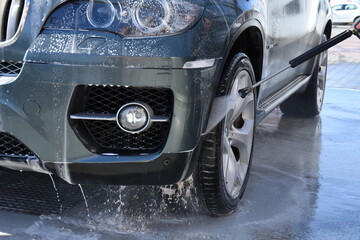 Wall Mural - Rear and front light of a  gray car -car wash