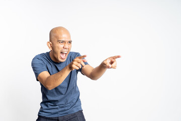 asian bald man opening mouth wide while laughing with both fingers pointing on isolated background