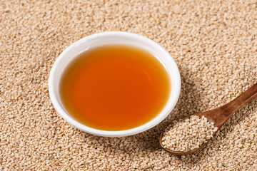 Wall Mural - Sesame Oil in a glass bowl background