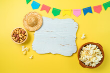Festa Junina Party Background With Popcorn, Peanuts And Wooden Board. Brazilian Summer Harvest Festival Concept. Top View, Flat Lay