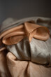 Close up of a stack of silk clothes - fine silk texture - fashion background
