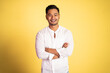 © Odua Images - asian young man wearing white shirt smiling with arms crossed on isolated background