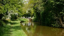 Idyllic Scene On The Oxford Canal A Distant Lock And Narrowboat