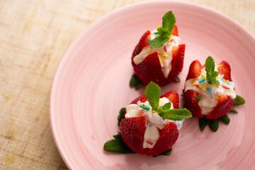 Wall Mural - Strawberries stuffed with cream. Traditional Barcelona dessert.