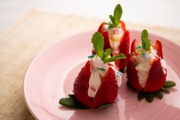 Wall Mural - Strawberries stuffed with cream. Traditional Barcelona dessert.