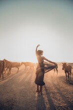 Girls Dancing In Desert With Horse