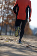 © 2Design - Rear view of one senior man in sport clothes jogging in the park in a sunny day