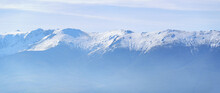 Panoramic View Of A Snowy Mountain Range In The Distance, Copyspace. La Pinilla, Segovia.