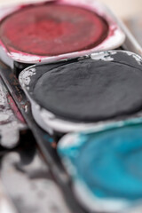 Wall Mural - Close-up macro shot of beautiful vibrant watercolour pallete with plenty of texture and details