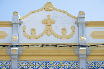 Wall Mural - Close view of a traditional decorated pediment in the village of Estoi, Algarve, Portugal