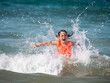 © 23_stockphotography - happy girl covered by a sea wave