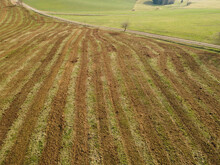 Aerial View Of Freshly Manure Fertilized Agricultural Field In Spring