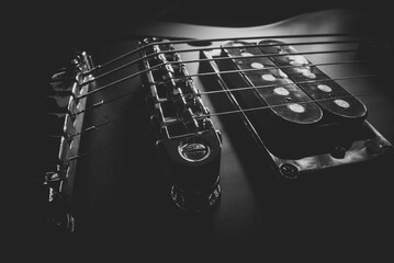 Six-string electric guitar bridge and saddle.