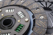 Close up of clutch disc of manual gearbox car, selective focus. Car clutch repair kit. Automotive spare parts.