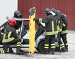 firefighters during the rescue operations of the injured with the stretcher