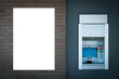 © vejaa - Mock up template. Vertical blank signboard, empty white placard near banking ATM, automated teller machine on brick wall outdoors