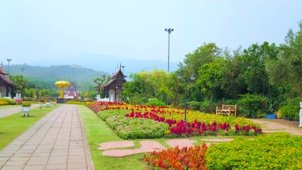 Wall Mural - Panorama of Rajapruek park with pavilions and flower beds, Chiang Mai, Thailand