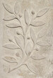 Stone wall with carved floral pattern	