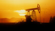 © Framestock - 3D render silhouette of an oil rig station that pumps oil from a well at sunset