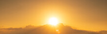 Bright Yellow Sun Over The Clouds. Bright Orange Sunrise On A Summer Morning. Sunny Sky Background