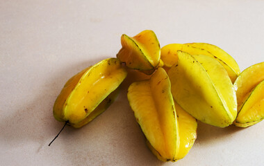 Six ripe star fruits on a white background