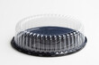 © Tada Images - Plastic cake container with clear dome lid isolated on a white background.