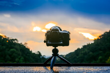 Back Dslr Camera On Mini Tripod Shooting Sunset Landscape